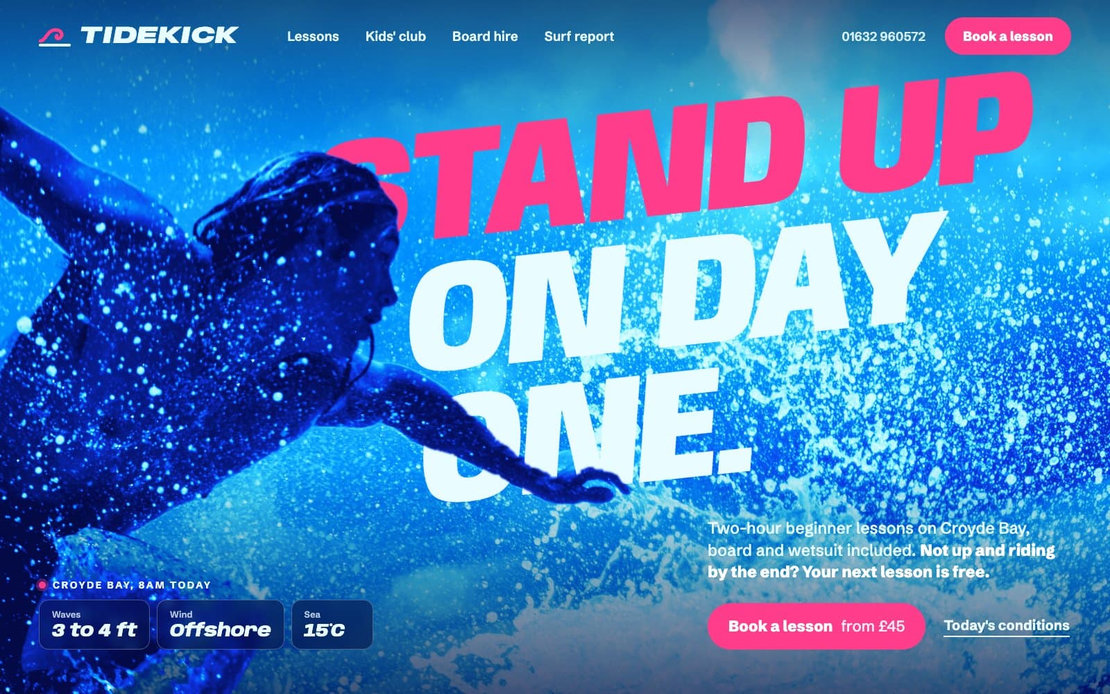 Homepage design for a surf school: a blue-toned photo of a surfer in spray, with a giant pink and white headline, Stand up on day one, running behind him